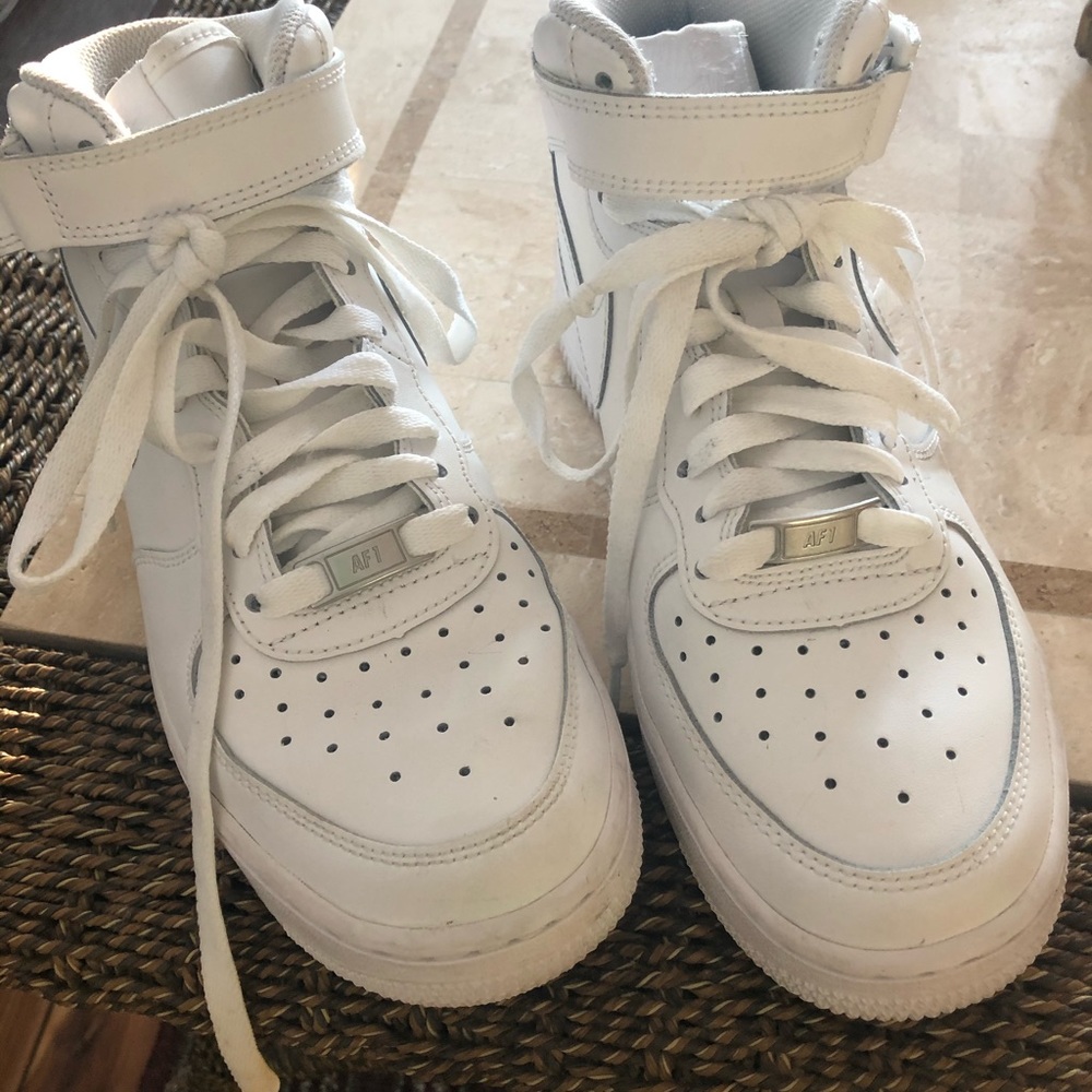 Boys Nike Air Force 1 high top sneakers.